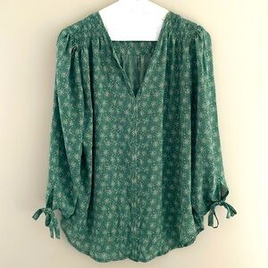 Green blouse bow ties on sleeves